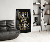gold Ball Is Life basketball typography glass wall art leaning beside a dark leather sofa
