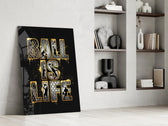 gold Ball Is Life basketball typography panel resting in a shelving niche in a modern interior