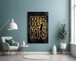 gold basketball typography with a jump-shot silhouette glass wall art styled above an armchair in a reading corner