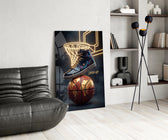 a high-top sneaker over a golden globe basketball glass wall art leaning beside a dark leather sofa