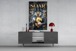suited bald eagle holding a gold dollar sign glass wall art displayed above a console in a designer interior