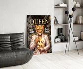 suited lioness with a gold dollar sign glass wall art leaning beside a dark leather sofa