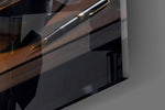 Close-up detail of the glowing city skyline and rising arrow inside the filament on the glass surface