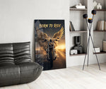 born to ride winged motorcycle glass wall art leaning beside a dark leather sofa