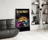 in the pocket golden turntable glass wall art leaning beside a dark leather sofa