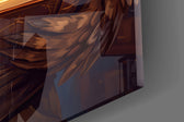 Close-up detail of the round spectacles, quill pen, and glowing open book on the glass surface