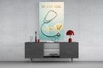sit stay heal veterinary stethoscope glass wall art displayed above a console in a designer interior