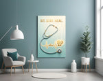sit stay heal veterinary stethoscope glass wall art styled above an armchair in a reading corner