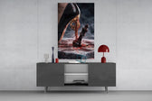 stiletto heel crushing a chess king glass wall art displayed above a console in a designer interior