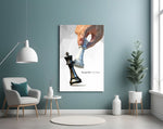 low-poly hand toppling a chess king glass wall art styled above an armchair in a reading corner