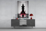 a pawn facing a king-sized shadow glass wall art displayed above a console in a designer interior