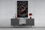red lipstick among brass bullet casings glass wall art displayed above a console in a designer interior