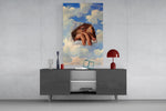 an eye and hand breaking through a painted sky glass wall art displayed above a console in a designer interior