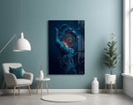 liquid water hand holding an ornate compass glass wall art styled above an armchair in a reading corner