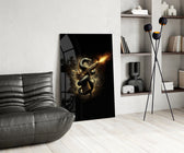 golden pistol wrapped by a black serpent glass wall art leaning beside a dark leather sofa