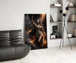 blindfolded Lady Justice with scales and sword glass wall art leaning beside a dark leather sofa