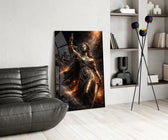 blindfolded Lady Justice with scales and sword glass wall art leaning beside a dark leather sofa