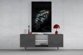 a serpent coiled around a firing pistol glass wall art displayed above a console in a designer interior