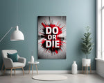 do or die splatter typography glass wall art styled above an armchair in a reading corner