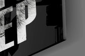 Close-up detail of the wolf's fur and pale eye showing through the letters on the glass surface