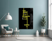 wake up dreams quote in yellow glass wall art styled above an armchair in a reading corner