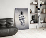 focus on the best chess king glass wall art leaning beside a dark leather sofa