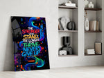 never give up neon graffiti quote panel resting in a shelving niche in a modern interior