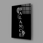 balance brain and heart quote glass wall art angled to show the polished tempered glass panel