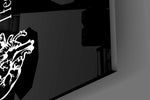 Close-up detail of the split brain and anatomical heart flanking the letters on the glass surface
