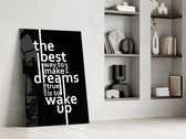 wake up dreams quote in black and white panel resting in a shelving niche in a modern interior