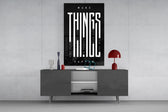 make things happen typography glass wall art displayed above a console in a designer interior