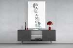 balance brain and heart typography glass wall art displayed above a console in a designer interior