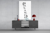 balance brain and heart typography glass wall art displayed above a console in a designer interior