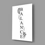 balance brain and heart typography glass wall art angled to show the polished tempered glass panel