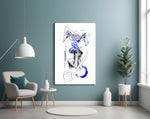 brain unravelling into blue threads glass wall art styled above an armchair in a reading corner