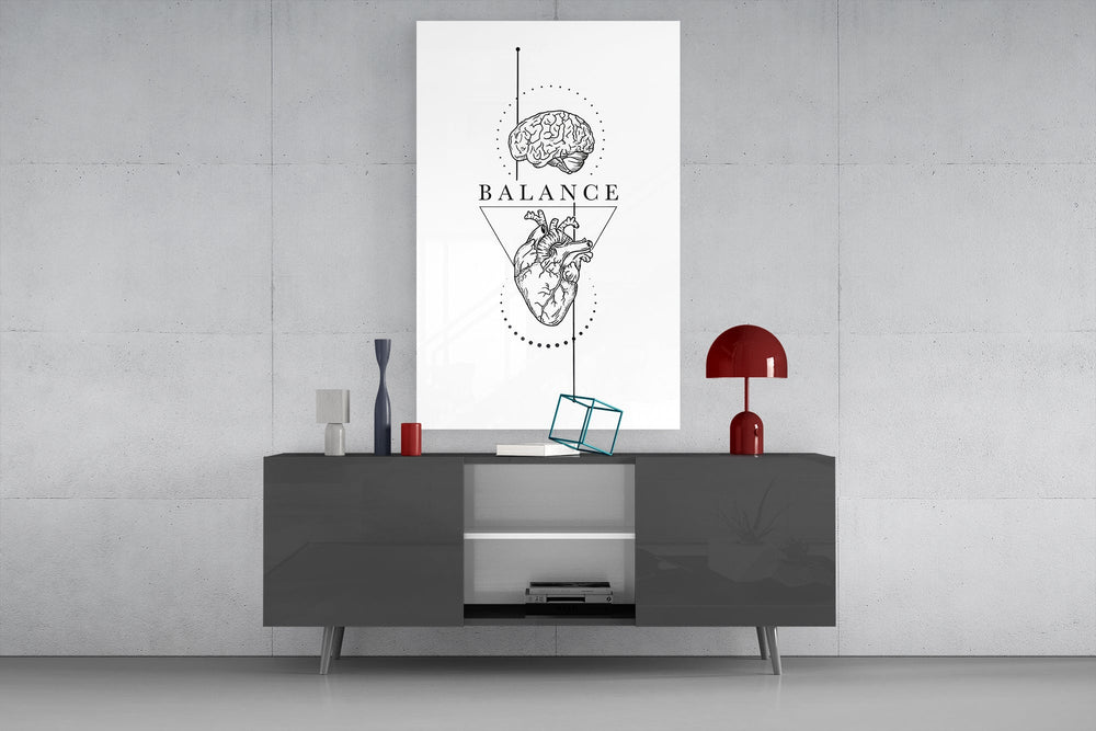 brain above heart balance line art glass wall art displayed above a console in a designer interior
