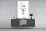 brain above heart balance line art glass wall art displayed above a console in a designer interior