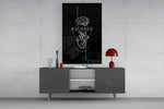 brain above heart balance on black glass wall art displayed above a console in a designer interior