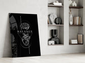 brain above heart balance on black panel resting in a shelving niche in a modern interior