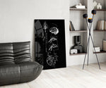 balance brain and heart line art glass wall art leaning beside a dark leather sofa