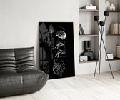 balance brain and heart line art glass wall art leaning beside a dark leather sofa