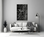 winged figure every fall to rise panel bringing character to a minimalist living room wall