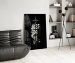 phoenix bold motivational typography glass wall art leaning beside a dark leather sofa