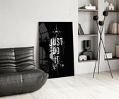 phoenix bold motivational typography glass wall art leaning beside a dark leather sofa