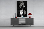 skeletal and living hands memento mori glass wall art displayed above a console in a designer interior