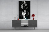 skeletal and living hands memento mori glass wall art displayed above a console in a designer interior