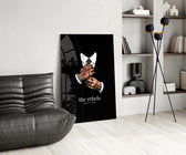 tattooed hands and the words the rebels never obey glass wall art leaning beside a dark leather sofa