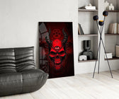 a red horned skull with a third eye glass wall art leaning beside a dark leather sofa