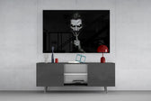 a grinning pale figure calling for silence glass wall art displayed above a console in a designer interior