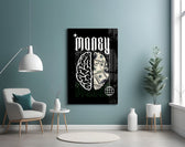 a brain half built from hundred-dollar bills glass wall art styled above an armchair in a reading corner